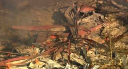 Debris covers the ground and vehicles after a powerful blast ripped through a military explosives manufacturing plant in Hickman County, Tennessee.