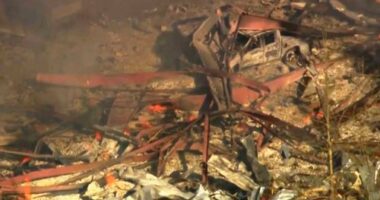 Debris covers the ground and vehicles after a powerful blast ripped through a military explosives manufacturing plant in Hickman County, Tennessee.