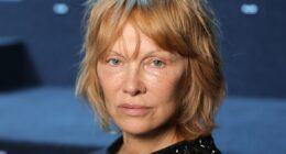 Pamela Anderson shows off strawberry blonde locks at Valentino show