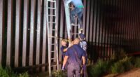 Smugglers ditch migrant atop border wall