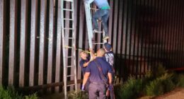 Smugglers ditch migrant atop border wall