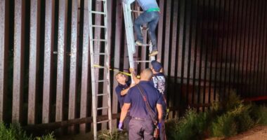 Smugglers ditch migrant atop border wall