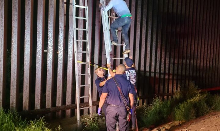 Smugglers ditch migrant atop border wall