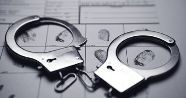 Photo of Handcuffs and fingerprints