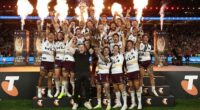 Adam Reynolds and Billy Walters of the Broncos hold aloft the Provan-Summons Trophy.