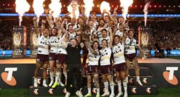 Adam Reynolds and Billy Walters of the Broncos hold aloft the Provan-Summons Trophy.