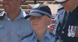 12-year-old Bryson in a police uniform after his make-a-wish day in collaboration with NSW police.