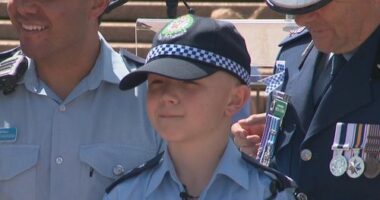 12-year-old Bryson in a police uniform after his make-a-wish day in collaboration with NSW police.