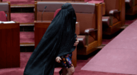 Senator Pauline Hanson wears a burqa in the Senate at Parliament House in Canberra on November 24, 2025. fedpol Photo: Dominic Lorrimer
