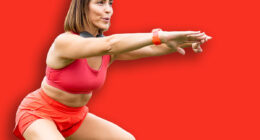 An attractive woman between 30 and 40 years old is doing sports outdoors.The woman is doing a squat to work her legs.Concept of adult women doing sports.