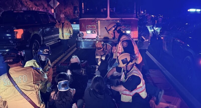 This image provided by San Bernardino County Fire shows the scene on a highway near Running Springs, Calif., where a bus overturned on Sunday, Nov. 9, 2025. (San Bernadino County Fire via AP