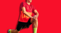 Warming-up muscles exercises before training. Man in sportswear, running athlete doing ATG split squat before training outdoors. Concept of sport, active and healthy lifestyle, competition, marathon