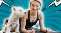 Portrait of happy blonde woman snuggling to adorable little dog while holding Forearm Plank Pose at home. Beautiful slim lady leading healthy lifestyle doing yoga whilst caring for furry friend.