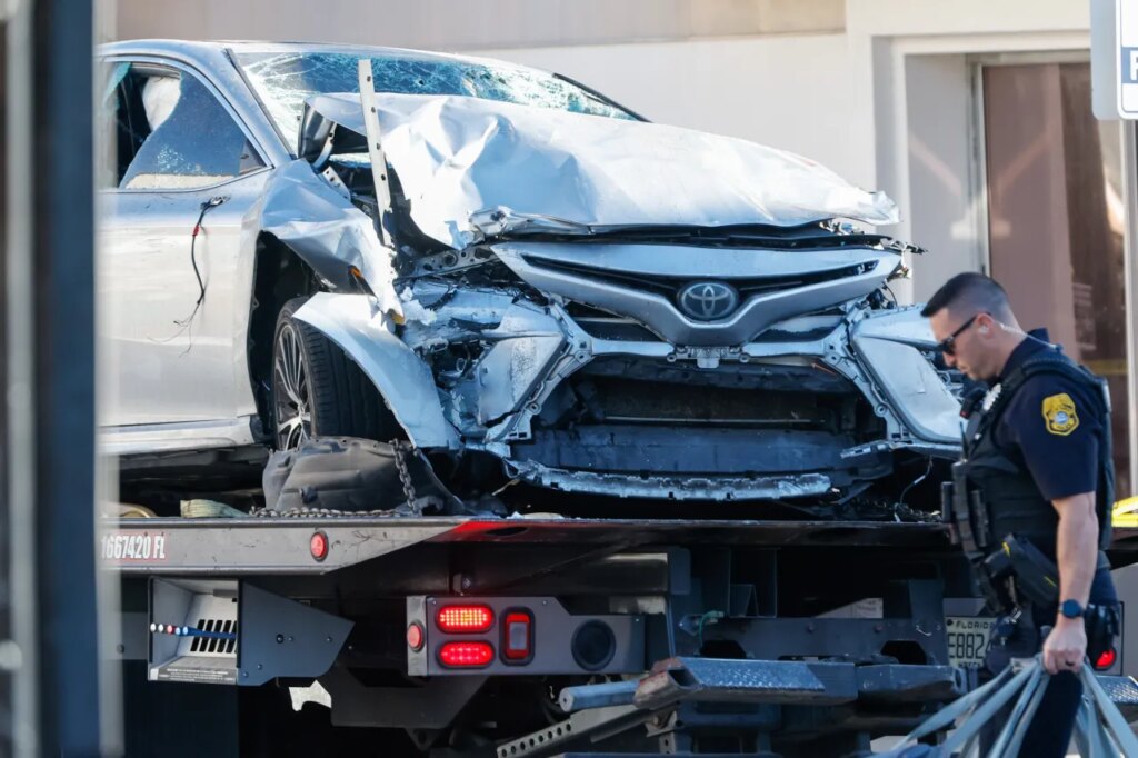 A vehicle that crashed into a local business is towed away, while law enforcement investigate the scene on Saturday, Nov. 8, 2025, in Tampa, Fla. (Jefferee Woo/Tampa Bay Times via AP)