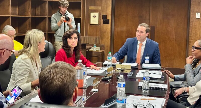 John Wahl, chairman of the Alabama Public Library Service Board of Directors, center right, listens during a meeting in Montgomery, Ala., Thursday, Nov. 20, 2025. (AP Photo/Kim Chandler)