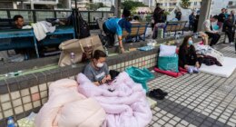 At least 94 dead as Hong Kong firefighters battle burning towers for a second day