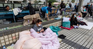 At least 94 dead as Hong Kong firefighters battle burning towers for a second day