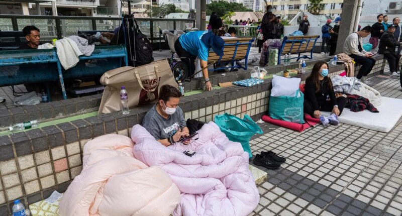 At least 94 dead as Hong Kong firefighters battle burning towers for a second day