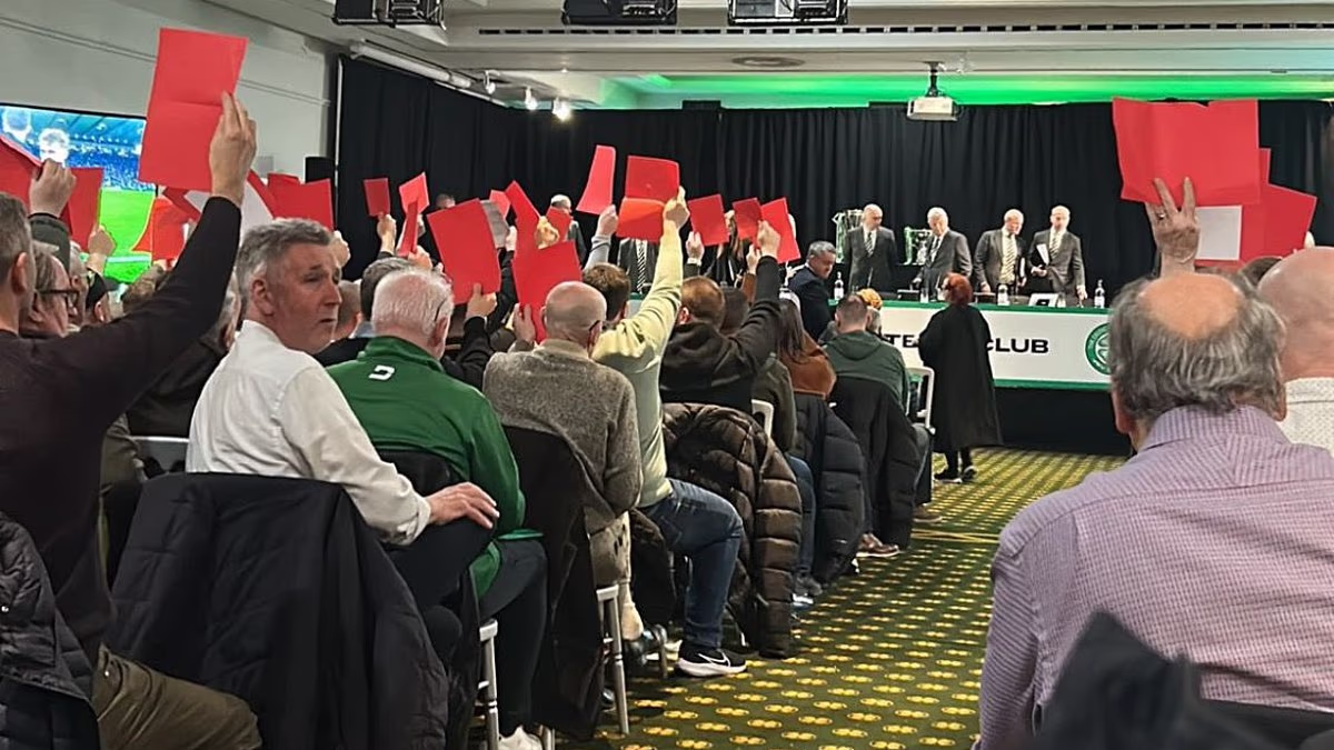 Celtic's annual general meeting ABANDONED after angry fans jeer board and wave red cards at top table... as director accuses them of 'dehumanising' senior club officials