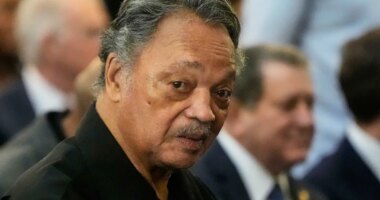FILE - The Rev. Jesse Jackson listens to speakers at the Tabernacle Baptist Church during the 60th anniversary of the march to ensure that African Americans could exercise their constitutional right to vote, March 9, 2025, in Selma, Ala. (AP Photo/Mike Stewart, File)