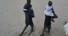 FILE - Residents wade through a flooded street in the aftermath of Hurricane Melissa in Petit-Goave, Haiti, Oct. 30, 2025. (AP Photo/Odelyn Joseph, File)