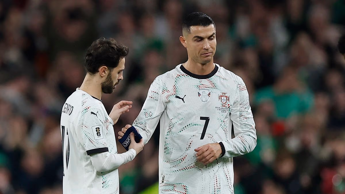 Cristiano Ronaldo sees RED: Portugal star is sent off for ELBOWING Ireland opponent before giving sarcastic response to decision - and he could miss country's World Cup opener