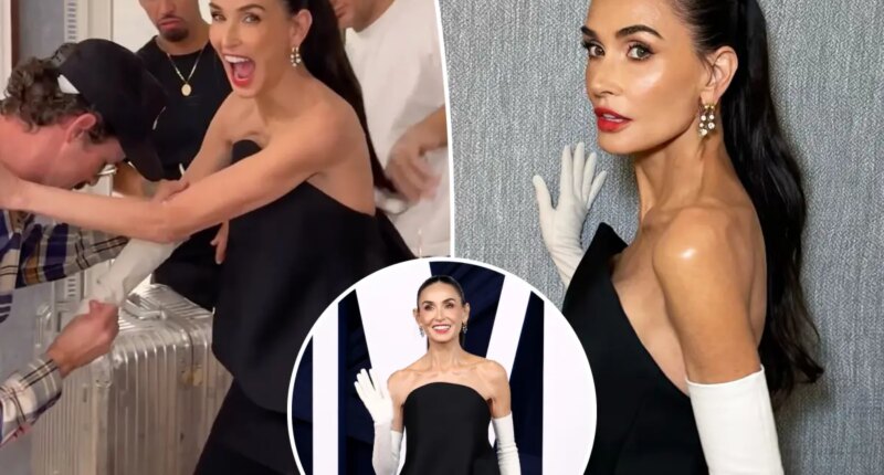 Demi Moore's gloves get stuck in Glamour Women of the Year Awards video