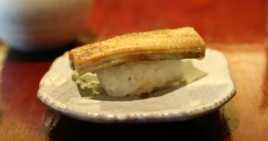 FILE - In this Thursday, July 20, 2017 photo, a dish of eel nigiri is served at Miyake, a Japanese restaurant, in Portland, Maine. (AP Photo/Robert F. Bukaty, File)