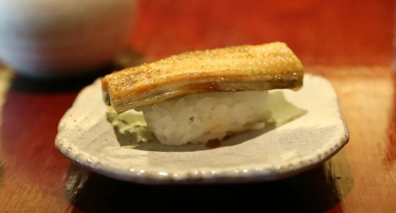FILE - In this Thursday, July 20, 2017 photo, a dish of eel nigiri is served at Miyake, a Japanese restaurant, in Portland, Maine. (AP Photo/Robert F. Bukaty, File)