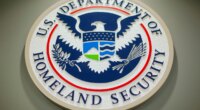FILE - The Department of Homeland Security logo is seen during a news conference in Washington, Feb. 25, 2015. (AP Photo/Pablo Martinez Monsivais, File)