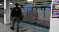 A Chicago police officer patrols the Clark Street and Lake Street Blue Line stop where a man doused a woman in liquid and set her on fire on the train Monday night, Tuesday, Nov. 18, 2025, in Chicago. (AP Photo/Erin Hooley)