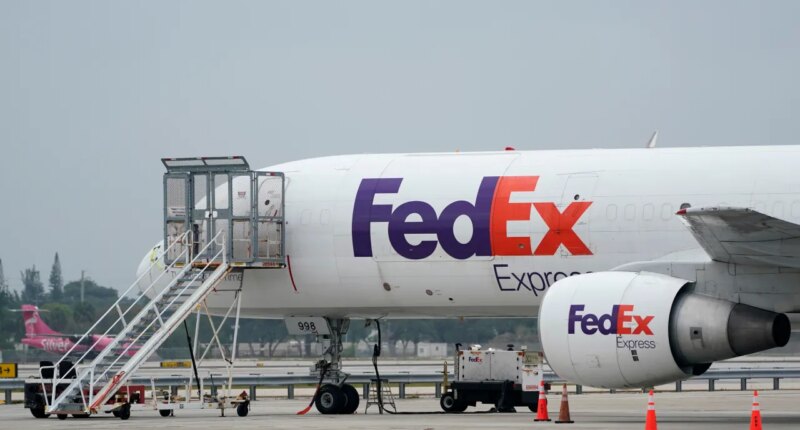 FILE - A FedEx cargo plane is shown on the tarmac at Fort Lauderdale-Hollywood International Airport, Tuesday, April 20, 2021, in Fort Lauderdale, Fla. (AP Photo/Wilfredo Lee, File)