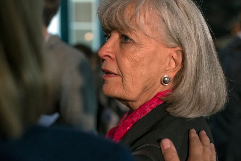 FILE - Former Kentucky Gov. Martha Layne Collins is consoled after Kentucky Democratic Senate Alison Grimes gave her concession speech, Tuesday Nov. 4, 2014 in Lexington, Ky. (AP Photo/ John Flavell, File)