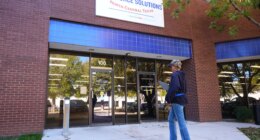 Cela Bratton Williams walks into the Workforce Solutions of North Central Texas office, Thursday, Oct. 30, 2025, in Plano, Texas. (AP Photo/Tony Gutierrez)