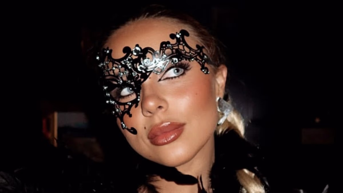 Gabby Allen shows off her figure in a plunging black corset