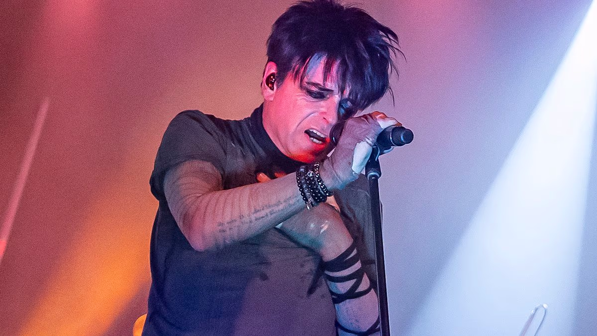 Gary Numan, 67, breaks down on stage during setlist after receiving the 'worst news' as his wife Gemma rushes to comfort him