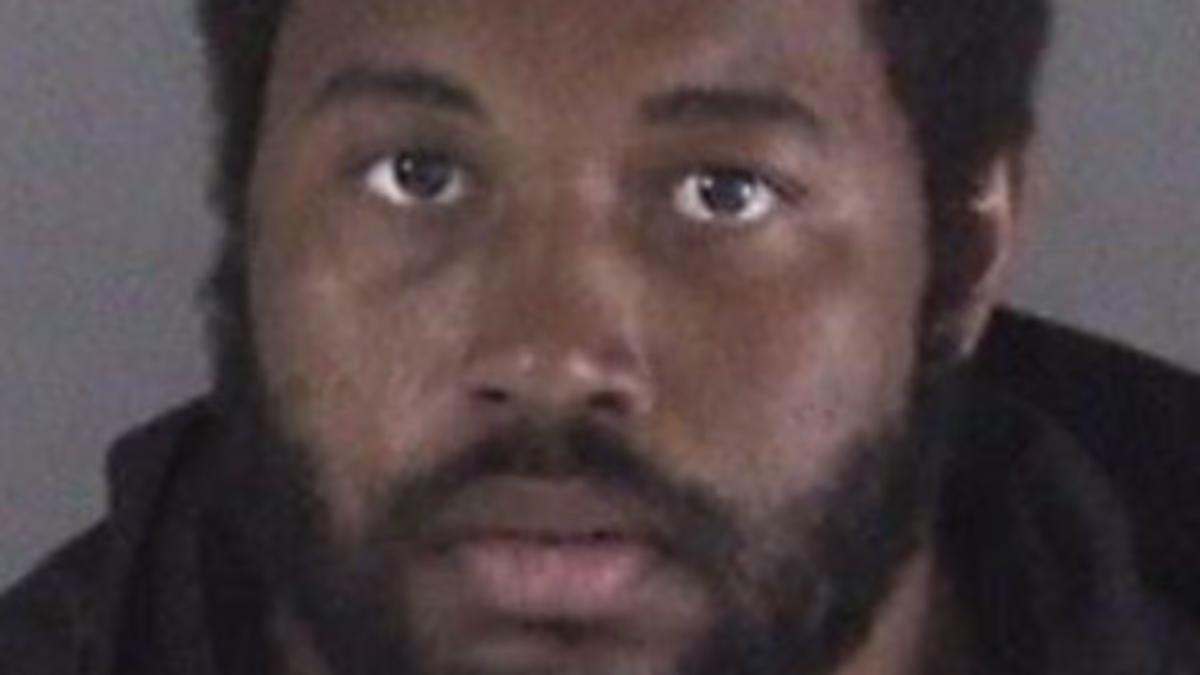 Gunman accused of killing Netflix star football coach John Beam pictured... as his stunned brother speaks out