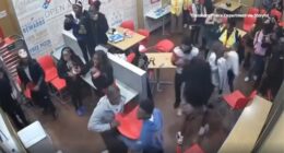 Halloween brawl at Domino's caught on camera, Glassboro, New Jersey police say officer hurt after chair thrown