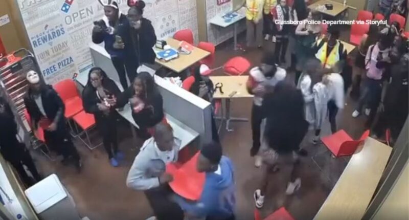 Halloween brawl at Domino's caught on camera, Glassboro, New Jersey police say officer hurt after chair thrown