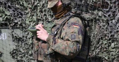 Soldiers of the Bundeswehr's Panzerbrigade 21 tank brigade equipped with electronic back and communication equipment seen during a visit on March 30, 2022 in Augustdorf, Germany.