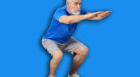 Elderly man exercising at home. Healthy leisure