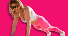 Woman looking fitness exercise videos on mobile phone during fitness workout outdoors