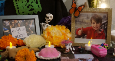 Photos commemorating the deadly shooting in August during Mass at Annunciation Catholic School in Minneapolis are part of an “ofrenda” marking Día de Muertos (Day of the Dead) at El Colegio High School in Minneapolis on Saturday, Nov. 1, 2025. (AP Photo/Giovanna Dell