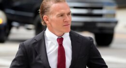 Former Green Beret Jordan Goudreau walks to the United States Courthouse for a bond hearing in Tampa, Fla., Wednesday, Oct. 29, 2025. (AP Photo/Chris O