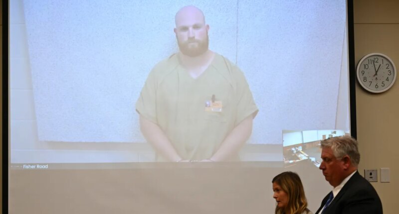FILE - Blendon Township police officer Connor Grubb listens while appearing via video from jail for his arraignment hearing, Aug. 14, 2024, at the Franklin County Court of Common Pleas in Columbus. (AP Photo/David Dermer, File)