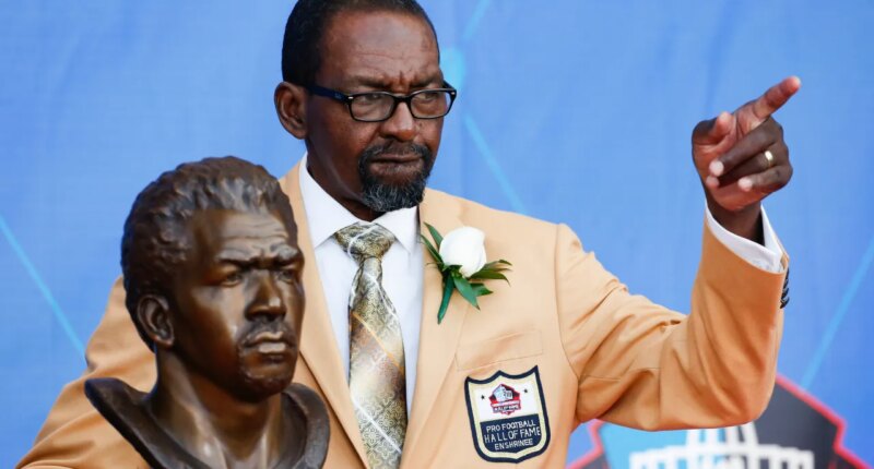 FILE - Former NFL player Kenny Easley poses with a bust of himself during an induction ceremony at the Pro Football Hall of Fame, Saturday, Aug. 5, 2017, in Canton, Ohio. (AP Photo/Ron Schwane, File)