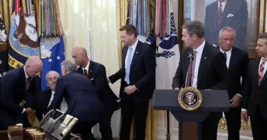 Man collapses behind Donald Trump during White House announcement