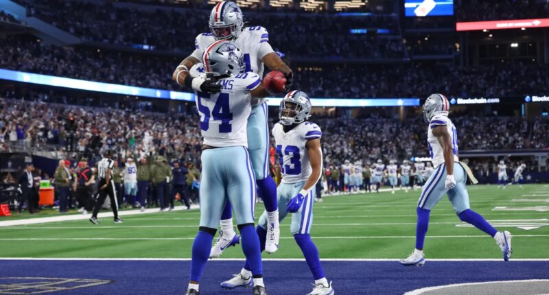 Dallas Cowboys defensive end Marshawn Kneeland and defensive end Sam Williams celebrate a touchdown