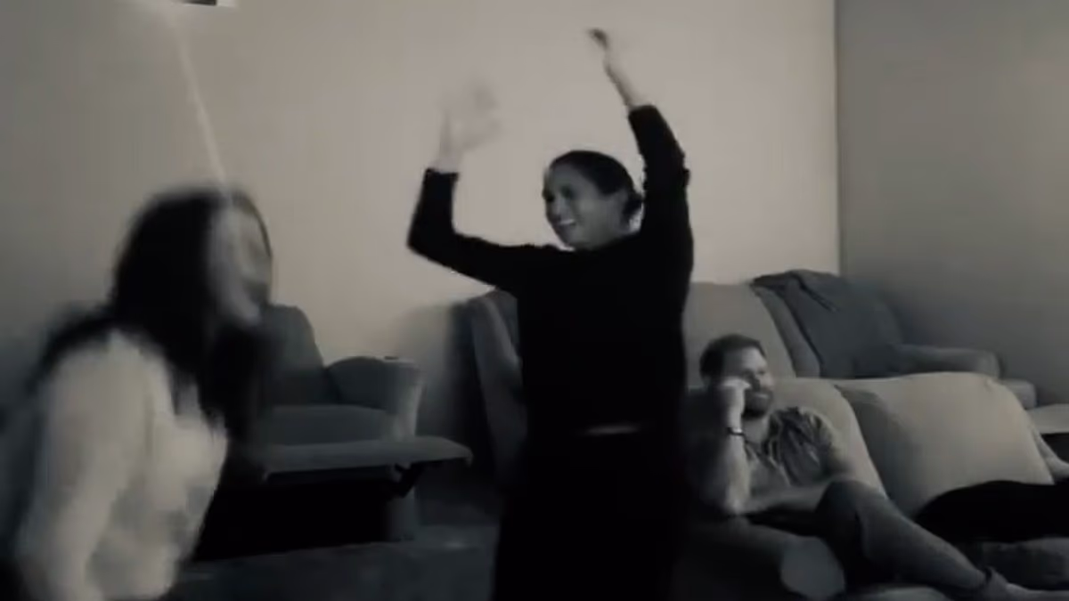 Meghan celebrates Dodgers' win alongside an unimpressed Prince Harry