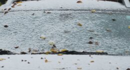 A car is covered with snow during a cold day in Evanston, Ill., Sunday, Nov. 9, 2025. (AP Photo/Nam Y. Huh)
